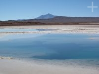 Water 'eye' on the Tolar Grande salt flat, on the Altiplano (Puna) of Salta, Argentina